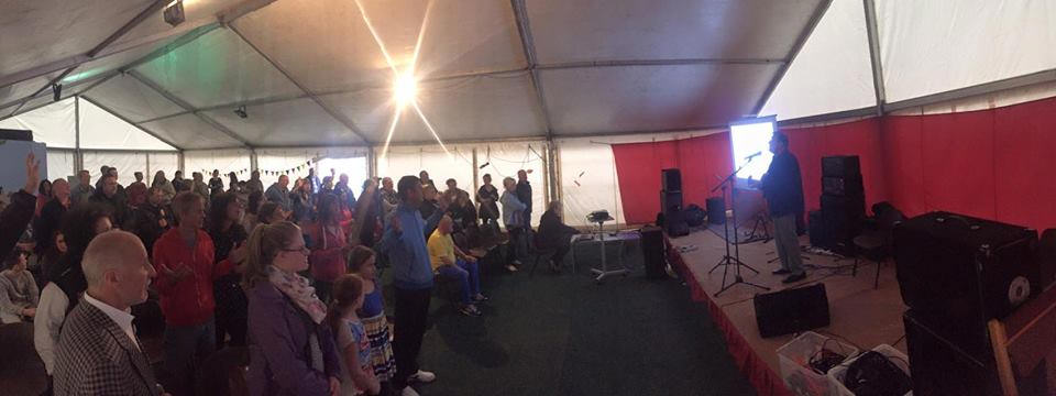 an evening meeting in the tent at newbold tent mission